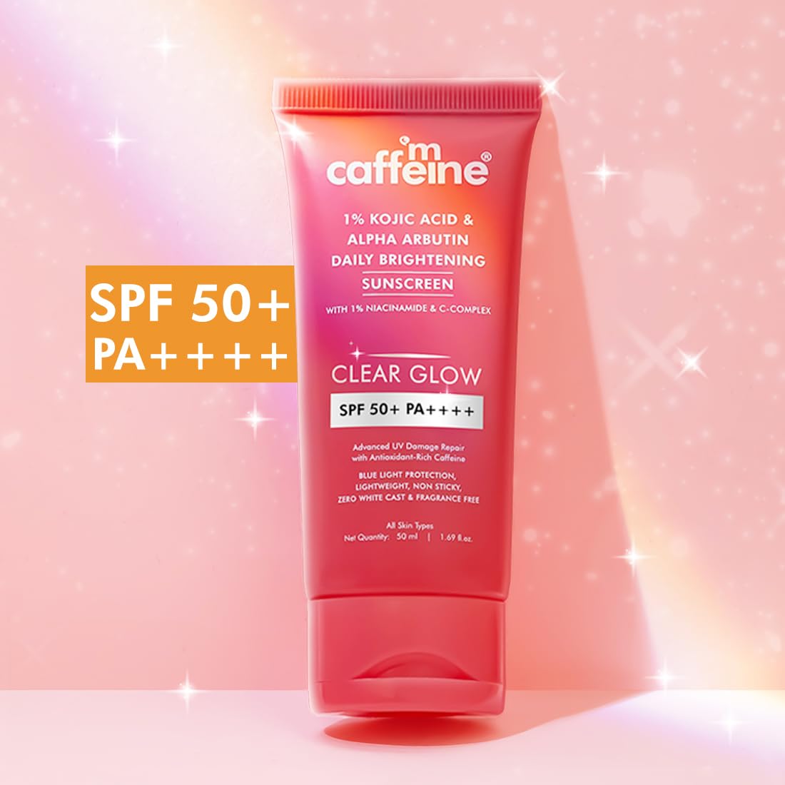 Caffeine skincare product with SPF 50+ on a pink background