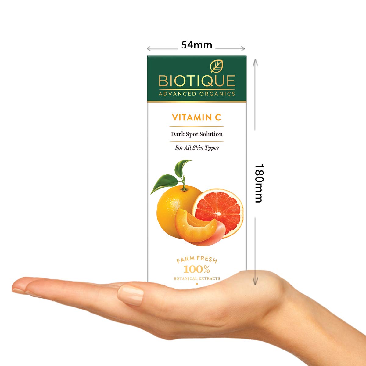 Biotique Vitamin C Dark Spot Solution packaging held in a hand with dimensions displayed.