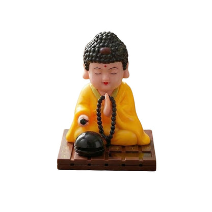 eCraftIndia Moving Head Monk Buddha Idol Showpiece for Home Decor Car Dashboard Office | Feng Shui Spiritual Meditation Buddha Statue Figurine for Good Luck Gift for Housewarming (Plastic, Yellow)