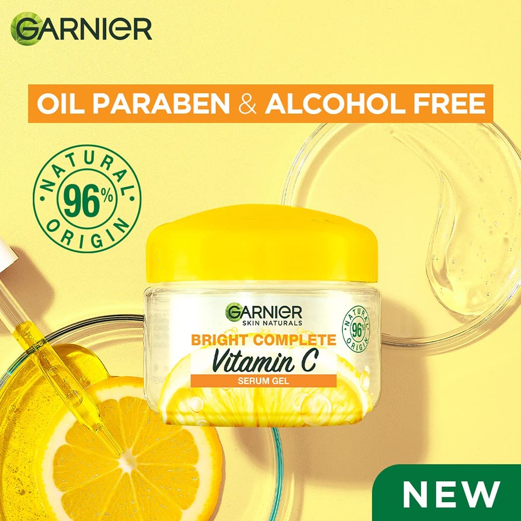 Garnier Bright Complete Vitamin C Serum Gel jar with lemon slices on a yellow background