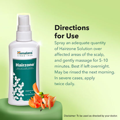 Himalaya Hairzone Solution bottle with usage directions on a green background