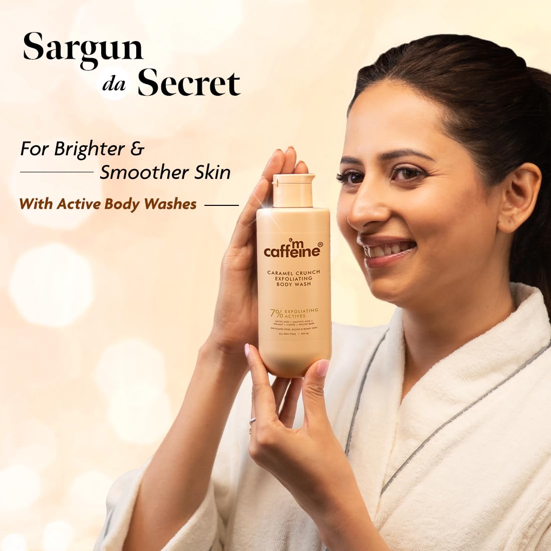 Woman holding a bottle of 'm caffeine' body wash with a blurred background