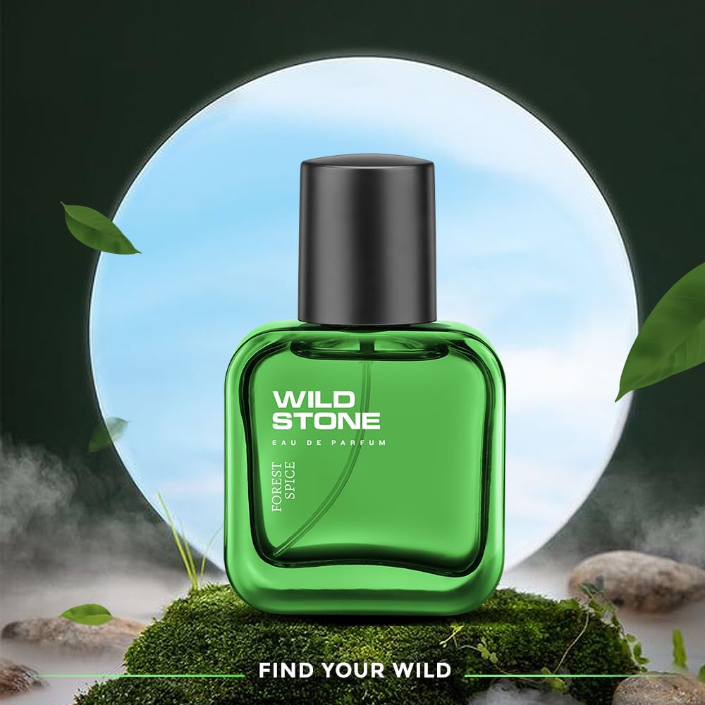 Green perfume bottle with 'Wild Stone' branding on a natural background