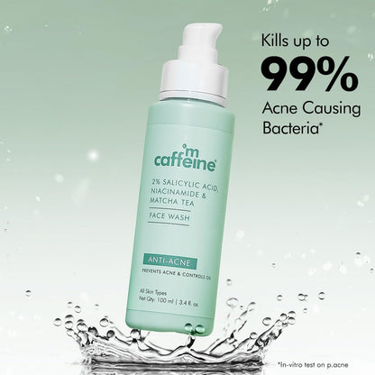Mcaffeine face wash bottle with water droplets and text about bacteria killing on a light green background