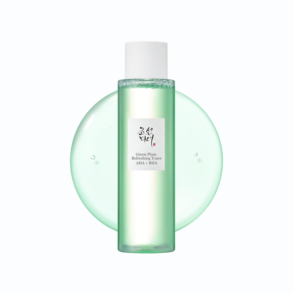 Skincare bottle with green liquid on a white background