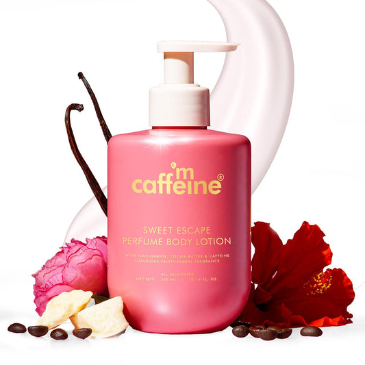 Pink 'm caffeine perfume body lotion with vanilla bean, flowers, and chocolate pieces on a white background