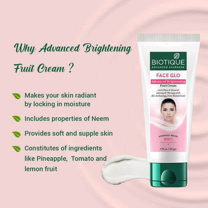 Biotique Advanced Brightening Fruit Cream tube with product benefits on a pink background