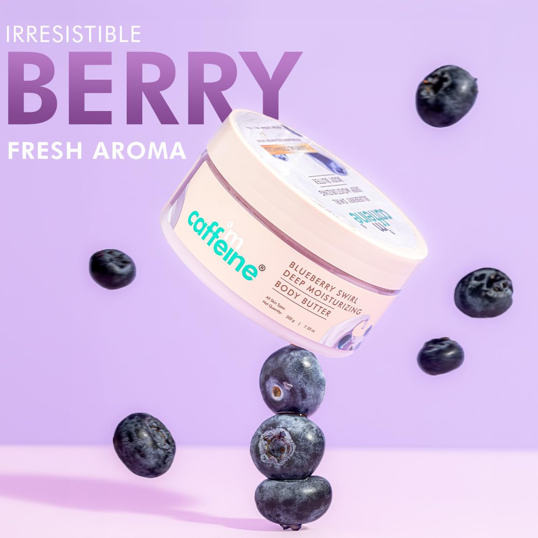 Caffeine Blueberry Swirl Deep Moisturizing Body Butter with blueberries on a purple background
