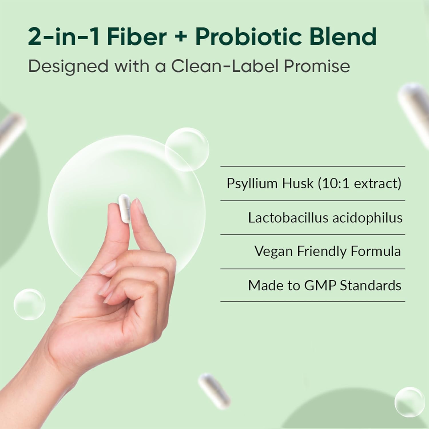 Hand holding a small container with fiber and probiotic blend information on a green background