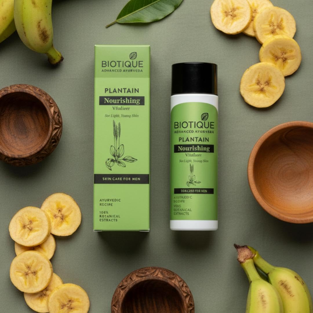 Biotique Plantain Nourishing skincare product with packaging on a green background with banana slices and leaves.