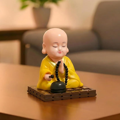 eCraftIndia Little Cute Buddha Monk Feng Shui Showpiece for Home Decor Office Car Dashboard | Moving Head and Hand Monk Buddha Statue for Positive Energy Money Luck Prosperity Gift (Plastic, Yellow)