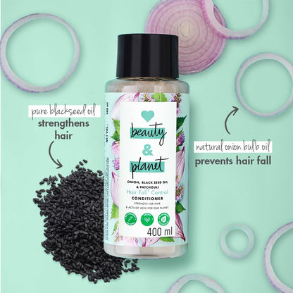 Beauty & Planet hair care product with black seeds and onion bulbs on a light green background