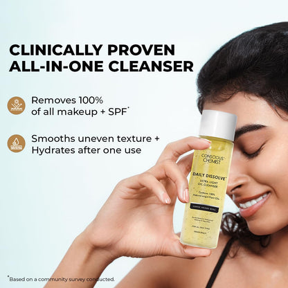 Woman holding a bottle of 'Conscious Chemist' cleanser with product details on a light gray background