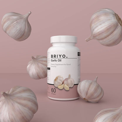BRIYO Garlic Oil supplement bottle with garlic bulbs on a pink background
