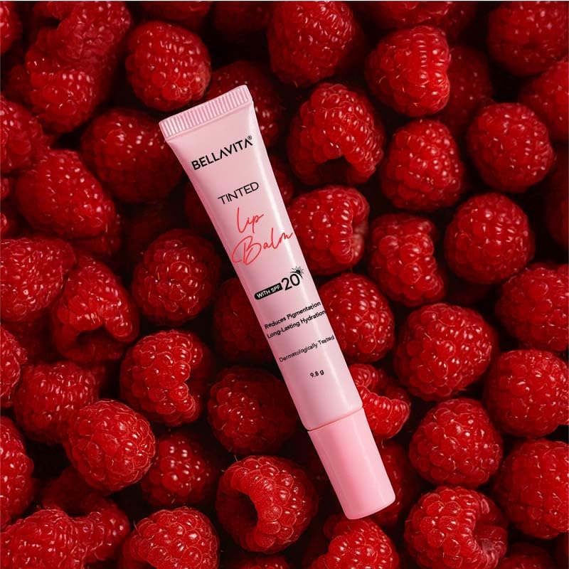 Bellavita tinted lip balm on a bed of raspberries