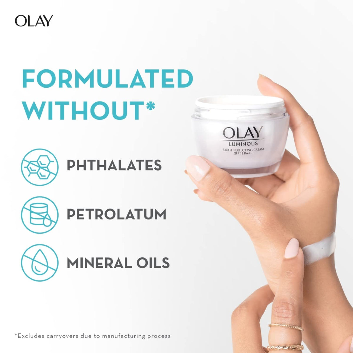 Olay Luminous cream jar held by a hand with text about ingredients on a white background