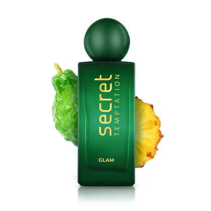 Green perfume bottle labeled 'Secret Temptation Glam' with a green leaf and pineapple slice on a white background