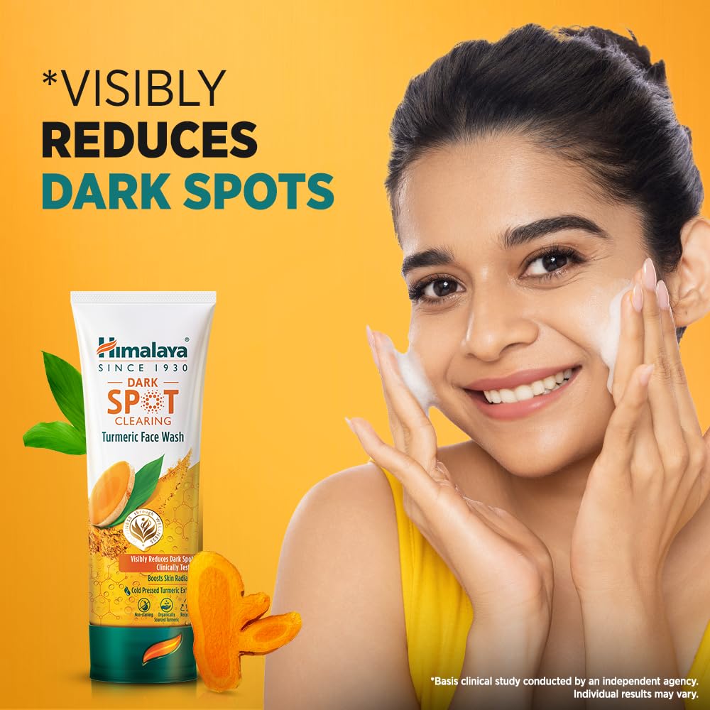 Himalaya Dark Spot Clearing Turmeric Face Wash with a woman applying it on her face against a yellow background
