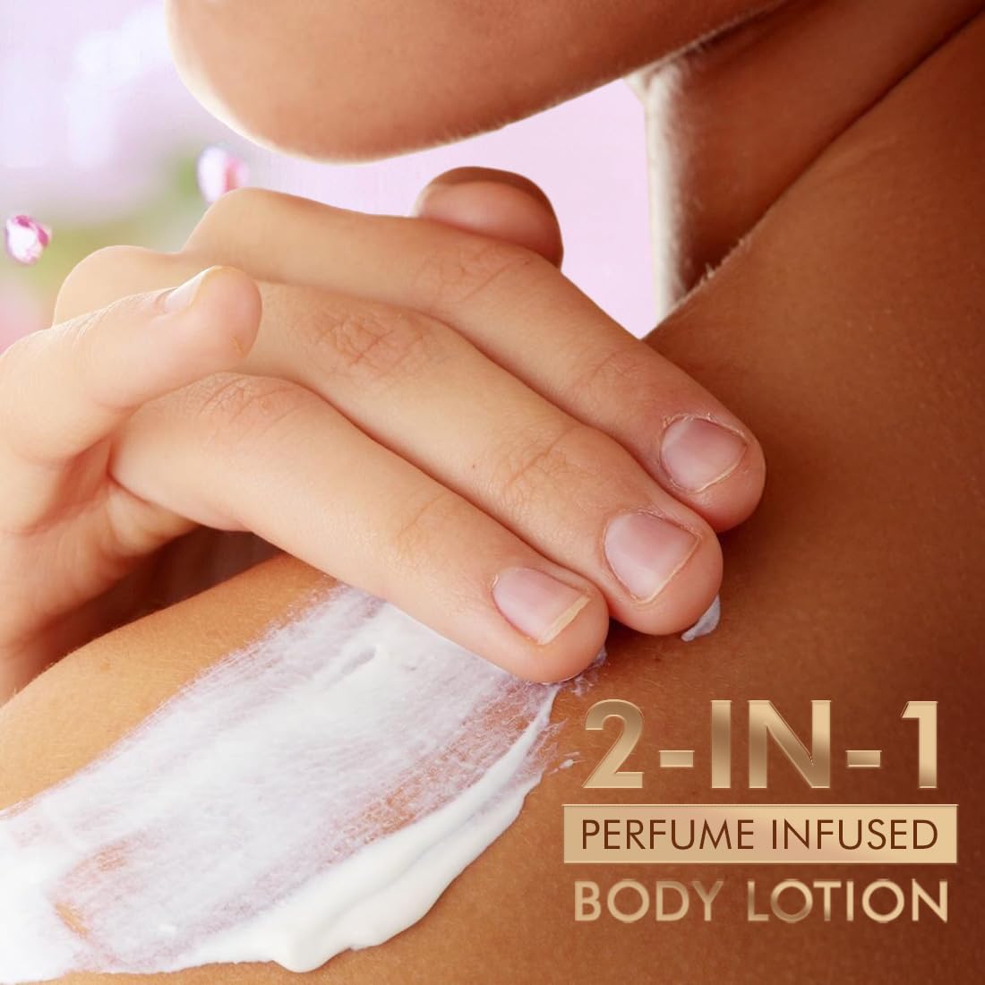 Hand applying 2-in-1 perfume infused body lotion to skin with a blurred background
