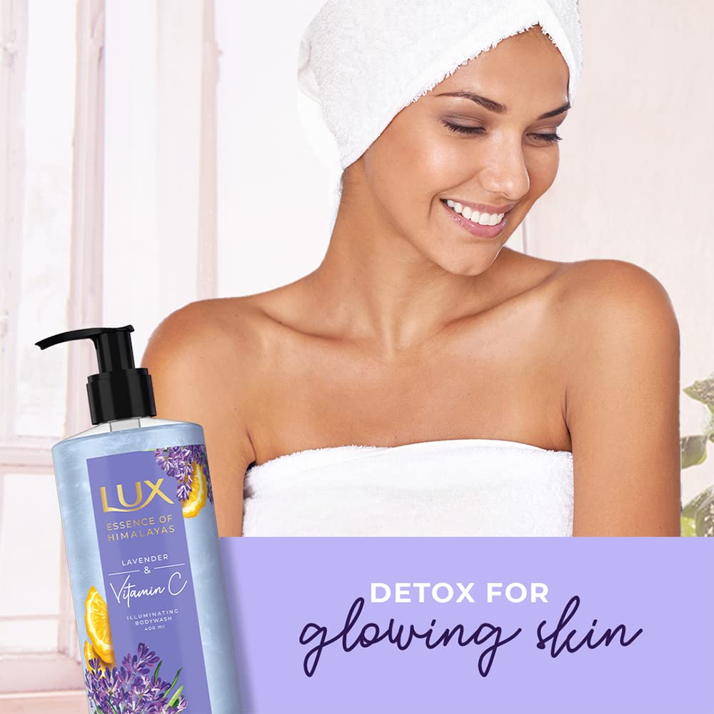 Woman with towel wrapped around her head next to a Lux body wash bottle with text 'Detox for glowing skin'.