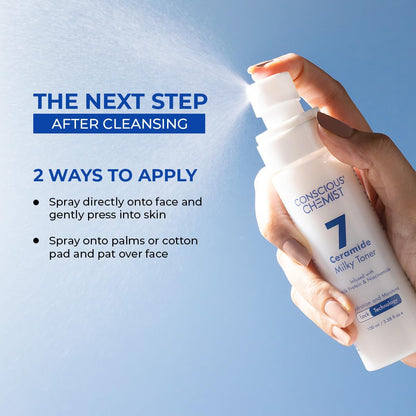 Hand holding a bottle of Conscious Chemist Ceramide Milky Toner with application instructions on a blue background
