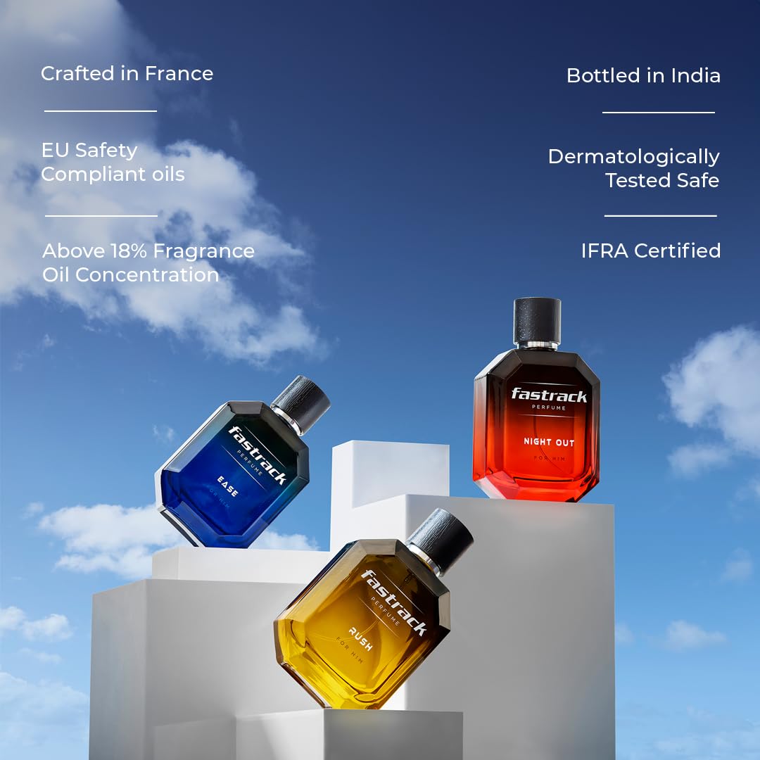 Three Fastrack perfume bottles on a geometric platform with a blue sky background.