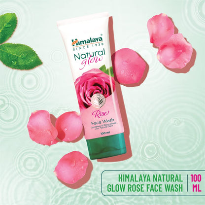 Himalaya Natural Glow Rose Face Wash with rose petals on a light green background