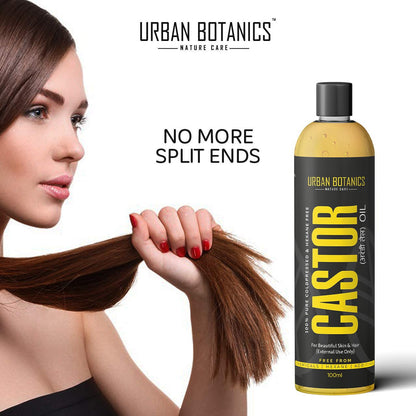 Woman holding hair with Urban Botanics Castor oil bottle on a white background