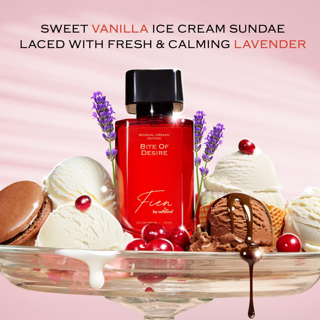 Red perfume bottle labeled 'Bite of Desire' surrounded by ice cream and cookies on a pink background
