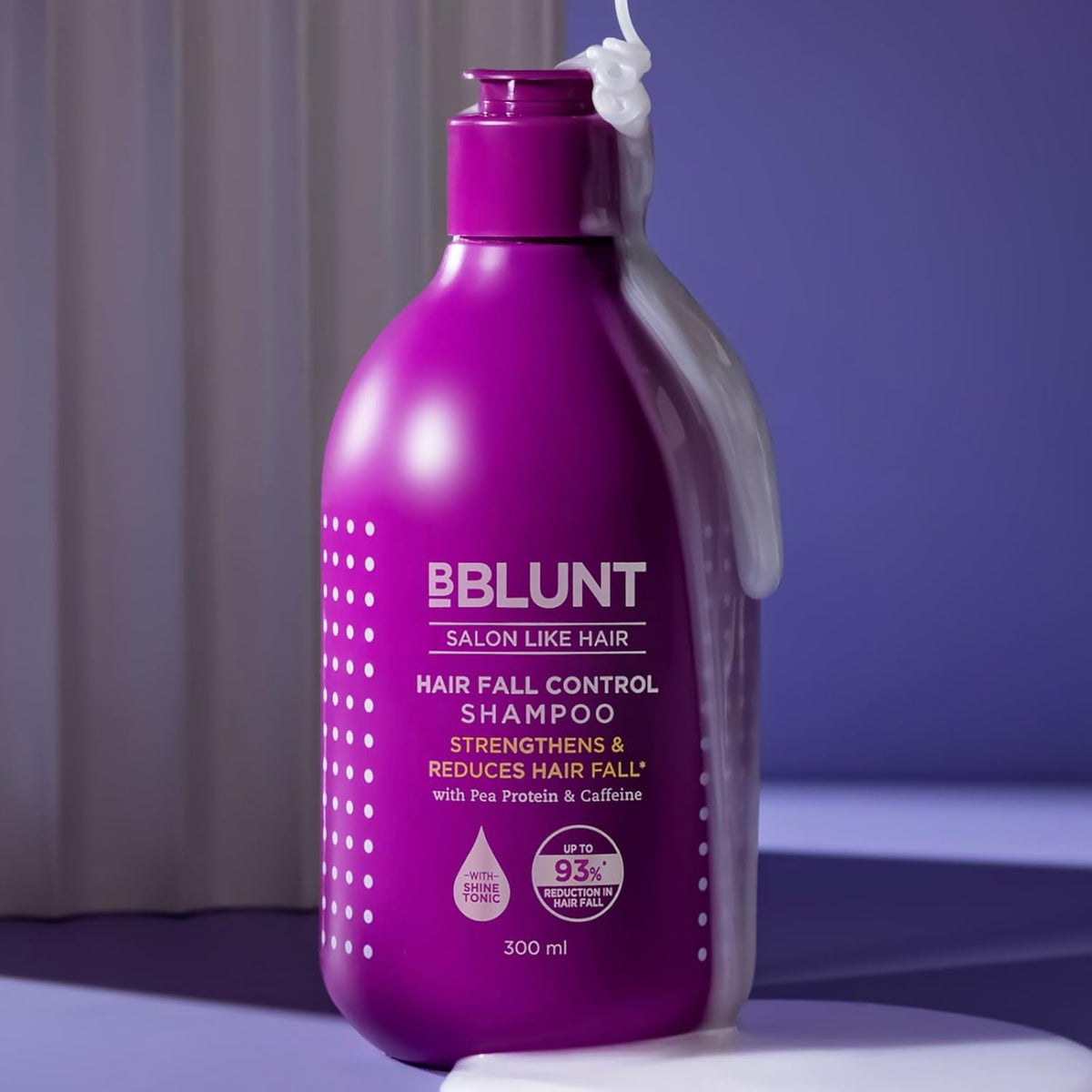 Purple shampoo bottle with text on a purple background