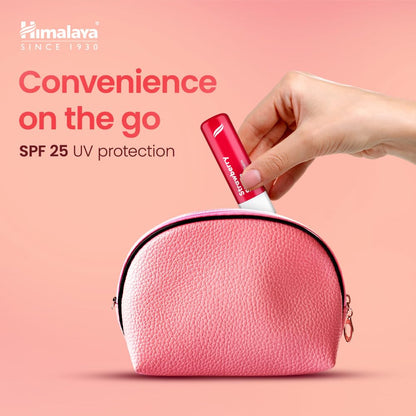 Hand holding a red Himalaya sunscreen stick above a pink pouch with 'Convenience on the go' text on a pink background.