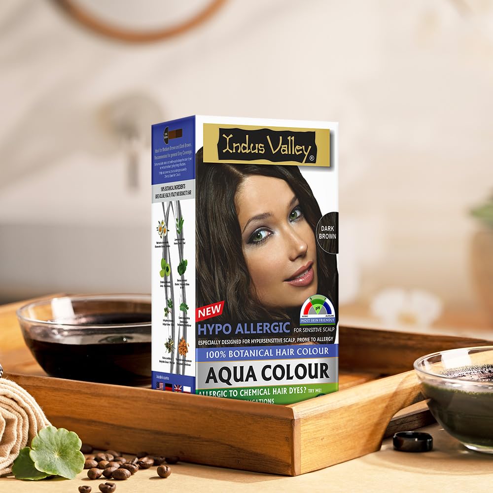 Indus Valley Aqua Colour hair dye box on a wooden tray with blurred background