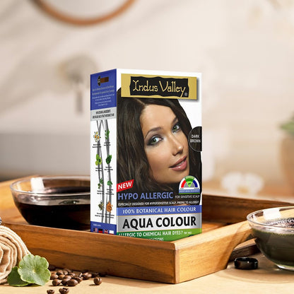 Indus Valley Aqua Colour hair dye box on a wooden tray with blurred background