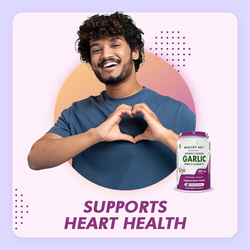 Man making a heart shape with his hands next to a bottle of Garlic supplements on a colorful background