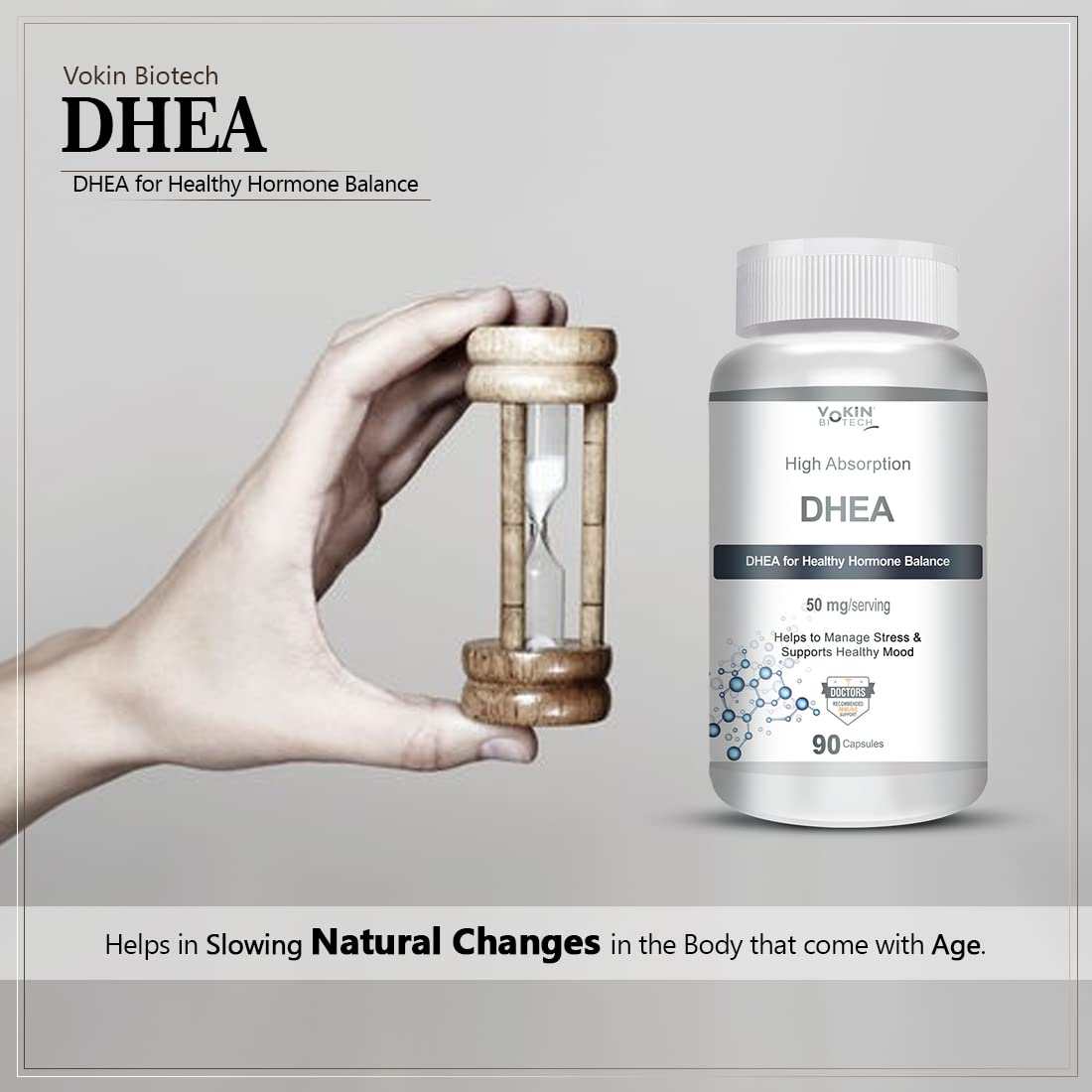 Vakin Biotech DHEA supplement bottle with a hand holding an hourglass on a gray background