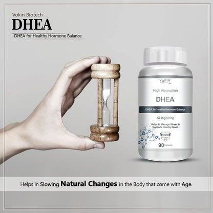 Vakin Biotech DHEA supplement bottle with a hand holding an hourglass on a gray background