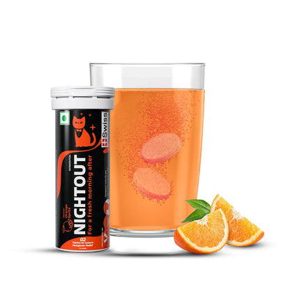 Caffeine-free Nightout supplement can with a glass of orange juice and slices on a white background