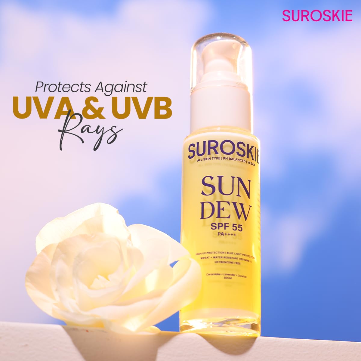 SUROSKIE SUN DEW SPF 55 sunscreen bottle with a white rose against a blue sky background