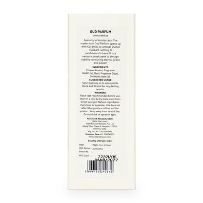 Back of a perfume packaging with text and a barcode on a white background