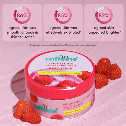 Caffeine Brightening Raspberry Rush Body Scrub with raspberries on a pink background