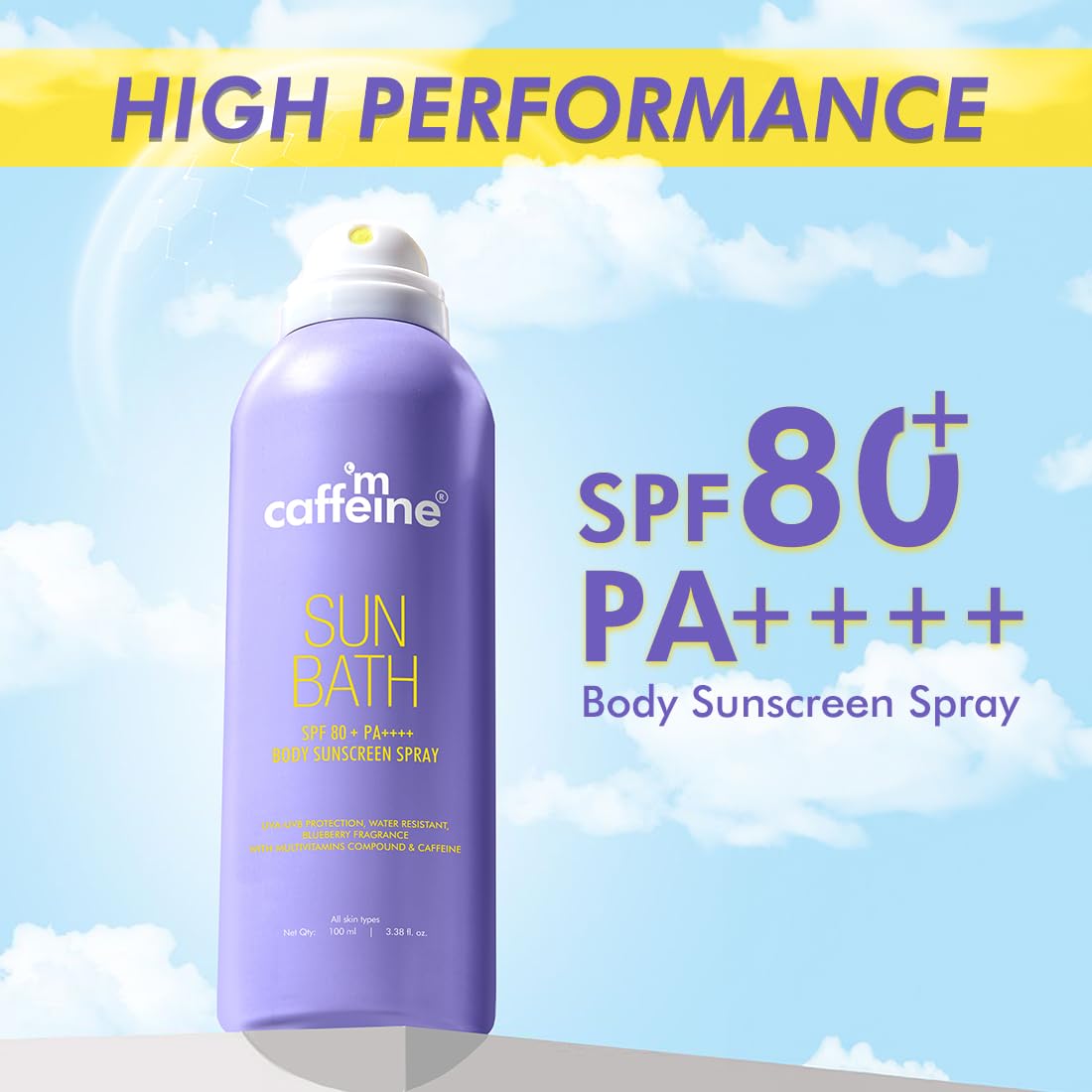 Purple sunscreen spray bottle with 'm caffeine' branding against a blue sky background