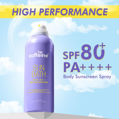 Purple sunscreen spray bottle with 'm caffeine' branding against a blue sky background