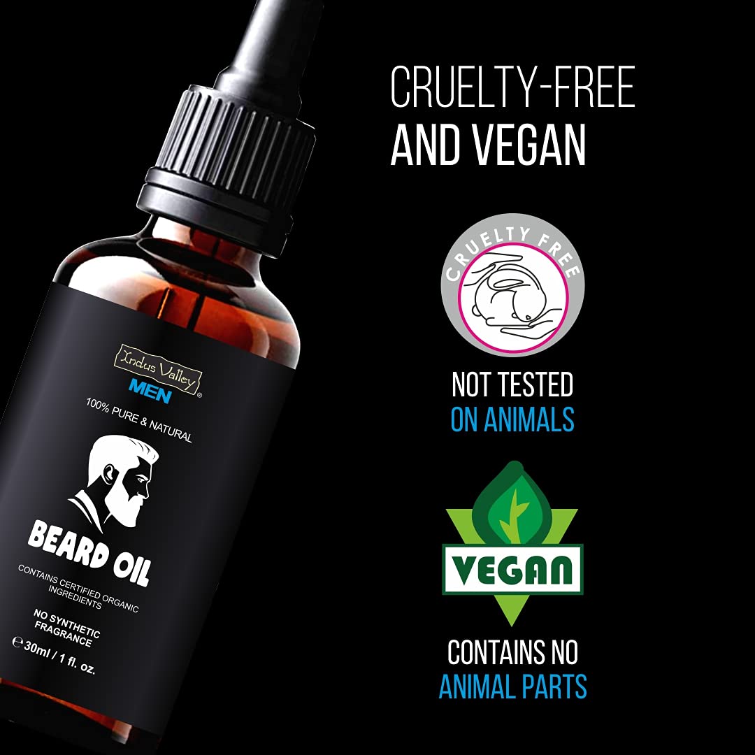 Beard oil bottle with 'Cruelty-Free' and 'Vegan' certification logos on a black background