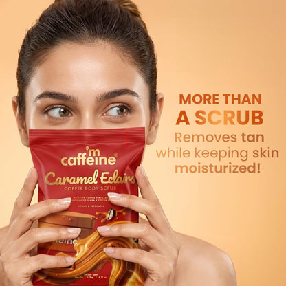 Woman holding a Caffeine Caramel Eclairs scrub packet with promotional text on an orange background