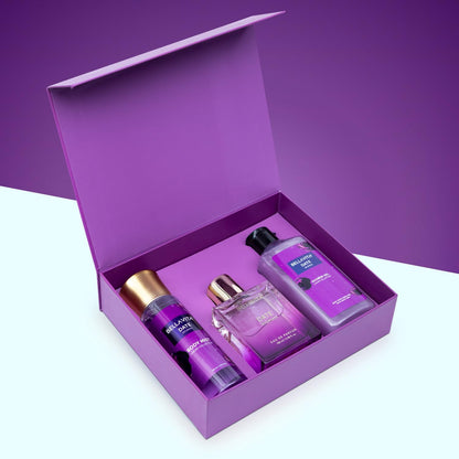 Purple perfume set with bottles and a box on a purple background