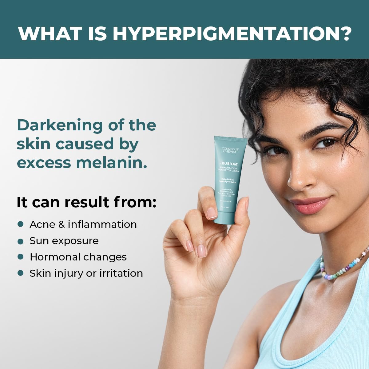 Woman holding a skincare product with information about hyperpigmentation on a gray background