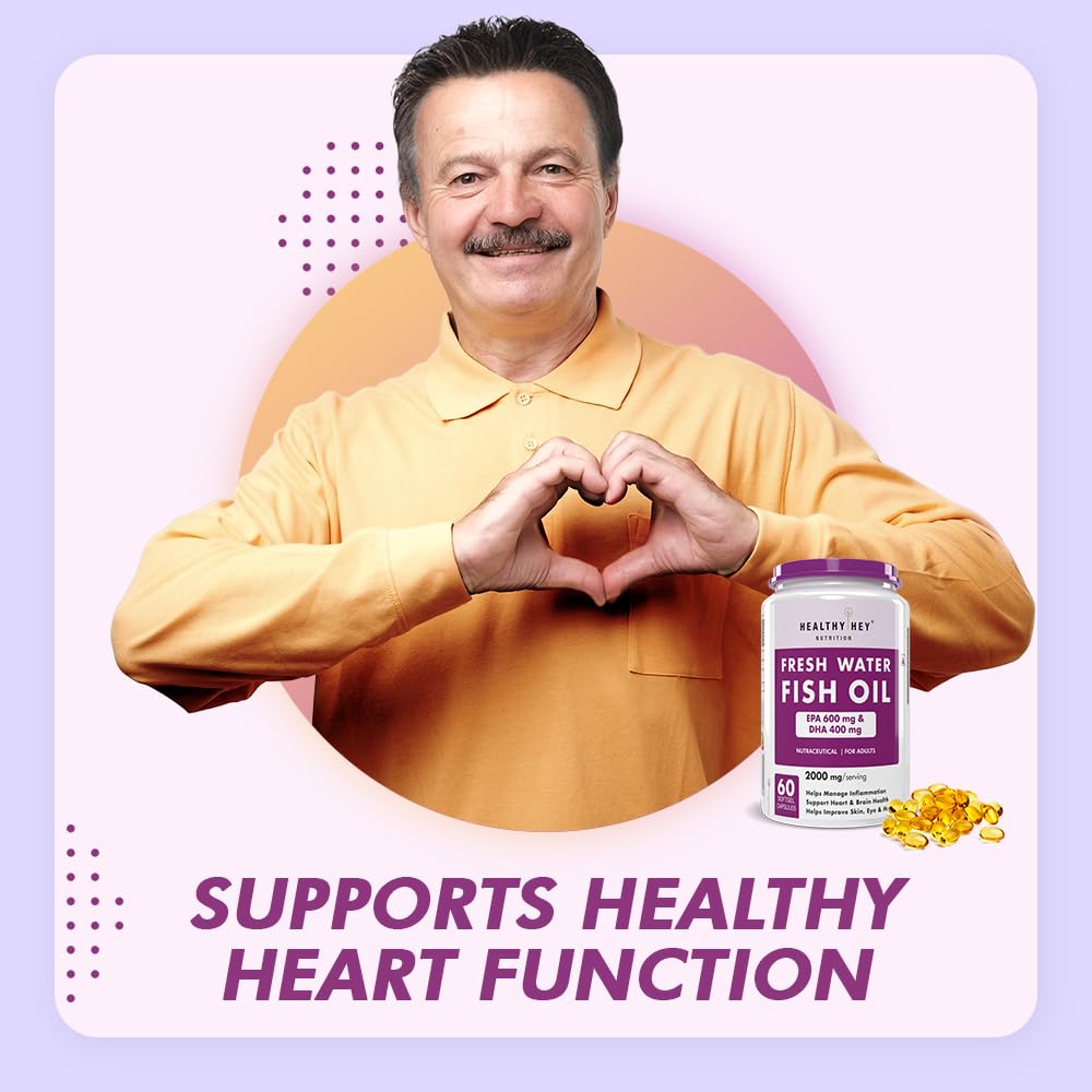 Man making a heart shape with his hands, holding a bottle of Fresh Water Fish Oil, on a light purple background.
