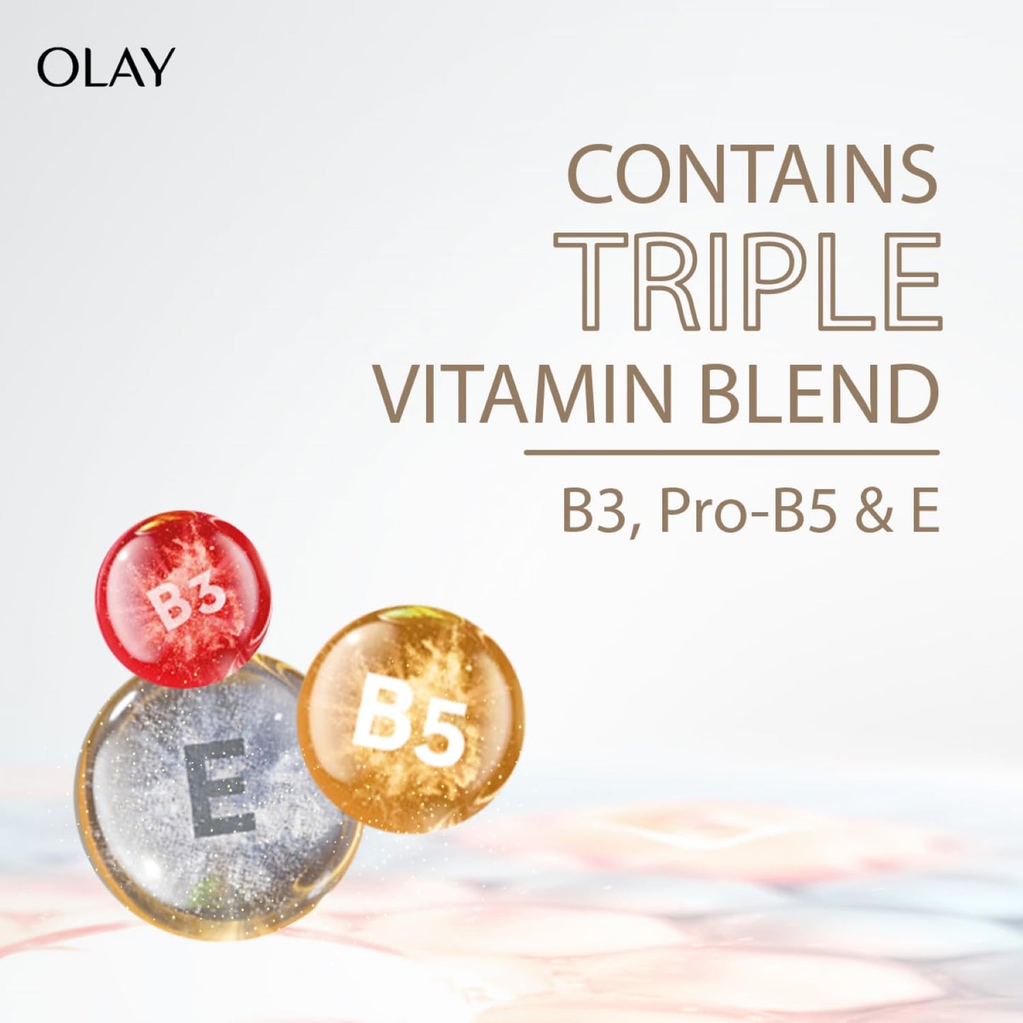 Olay advertisement with vitamins labeled B3, Pro-B5, and E on a light background.