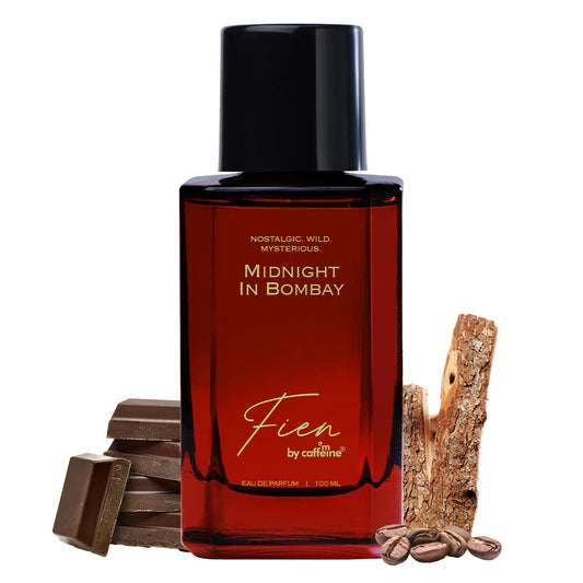 Red perfume bottle labeled 'Midnight in Bombay' by Fien on a white background