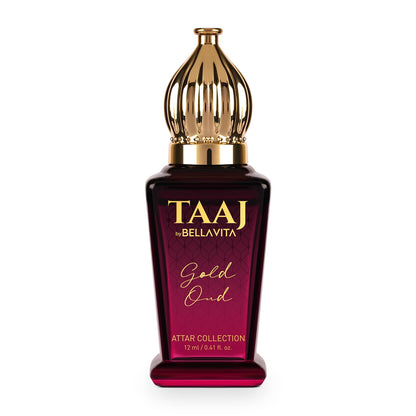 Perfume bottle with gold cap and maroon base on a white background